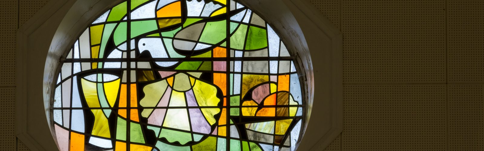 Stained glass window with dove